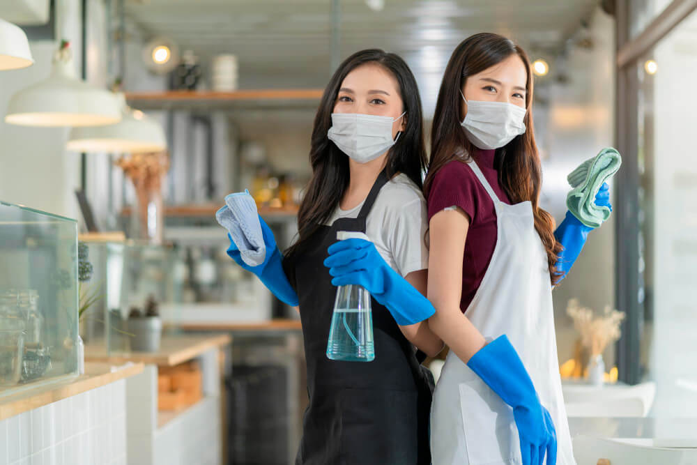 portrait-asian-waitress-with-apron-staff-wearing-protection-rubber-glove-face-mask-protection-hand-hold-cleaning-towel-alcohol-spray-disinfectant-protect-infection-coronavirus-health-ideas
